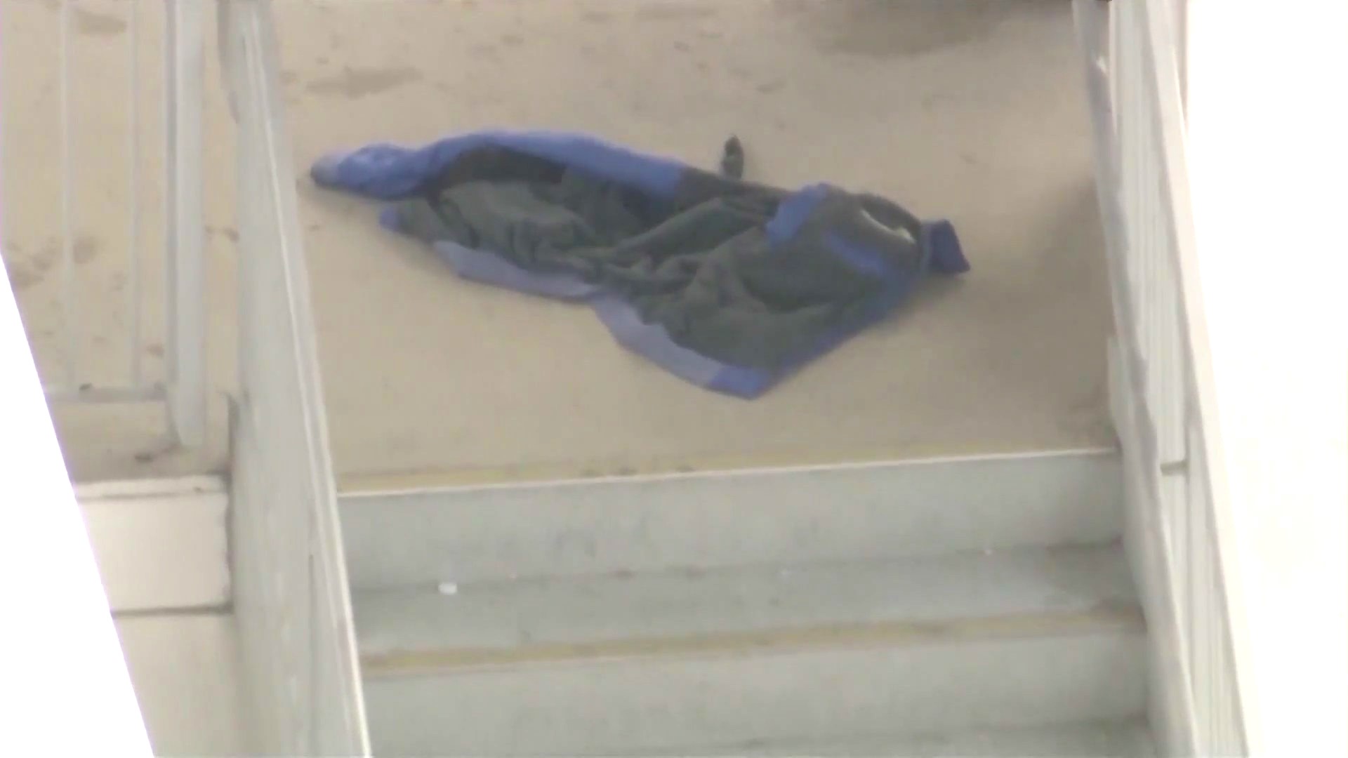 A jacket and a knife was spotted in a stairwell at the parking structure at El Camino College after an attempted murder-suicide involving a son and his mother on August 9, 2024. (KTLA)