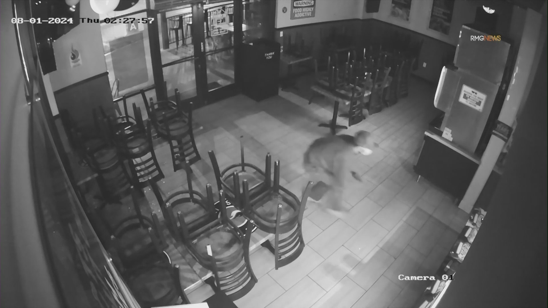 Security video captured a burglar crawling through a smashed window and heading straight to the cash register at Teriyaki Madness in the San Fernando Valley. (Teriyaki Madness)