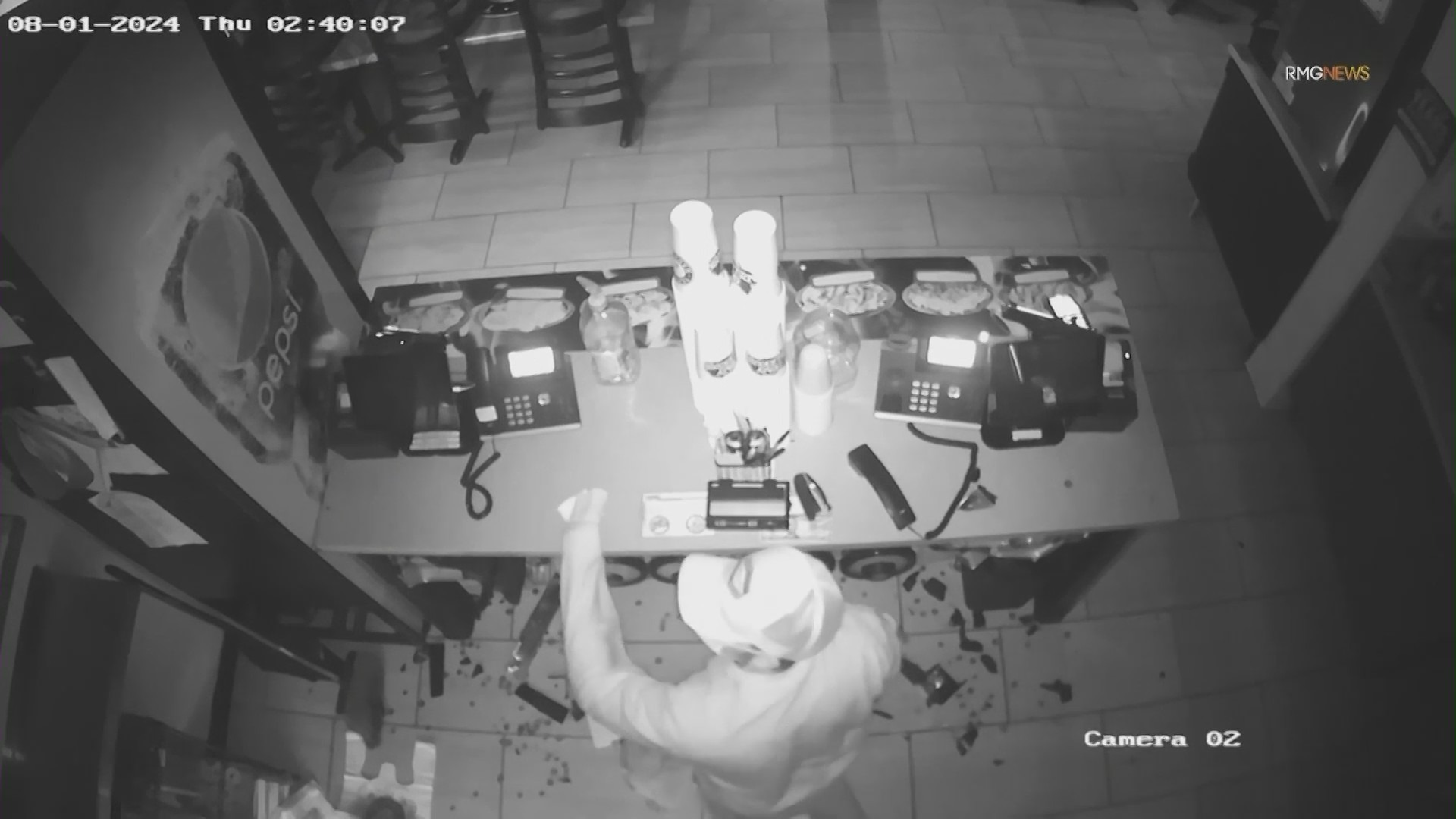 The thief is seen writing an apology note during a break-in at Teriyaki Madness. (Teriyaki Madness)