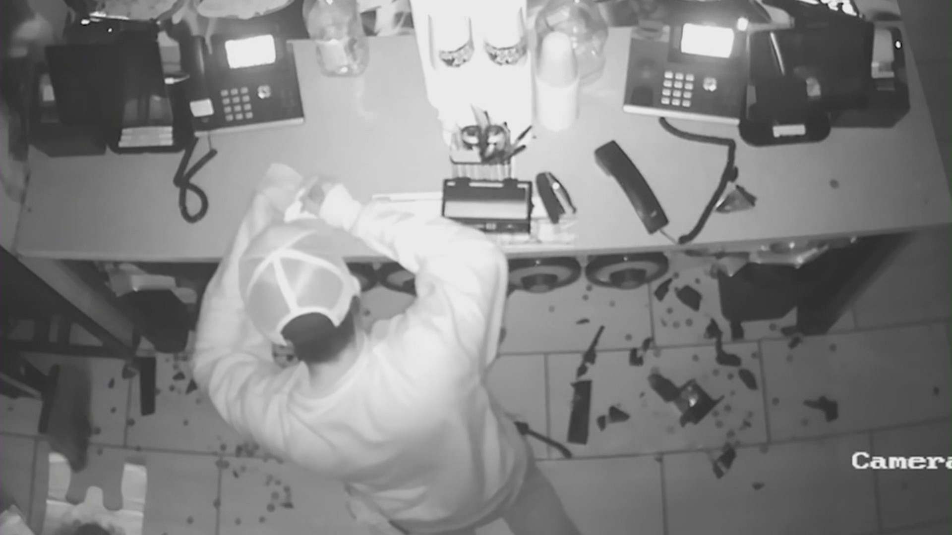 The thief is seen writing an apology note during a break-in at Teriyaki Madness. (Teriyaki Madness)