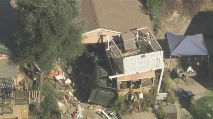 The home of the missing couple's next-door neighbor, Michael Sparks, was raided and destroyed by SWAT Team members and law enforcement on August 29, 2024. (KTLA)