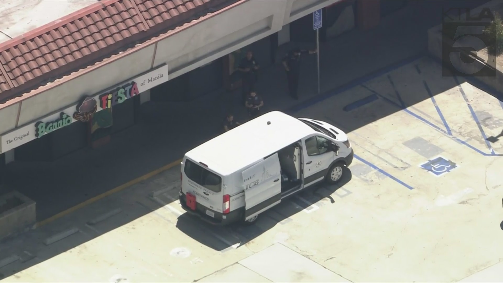 Authorities transport the victim's body after he was fatally shot at a Glendale strip mall on August 15, 2024. (KTLA)