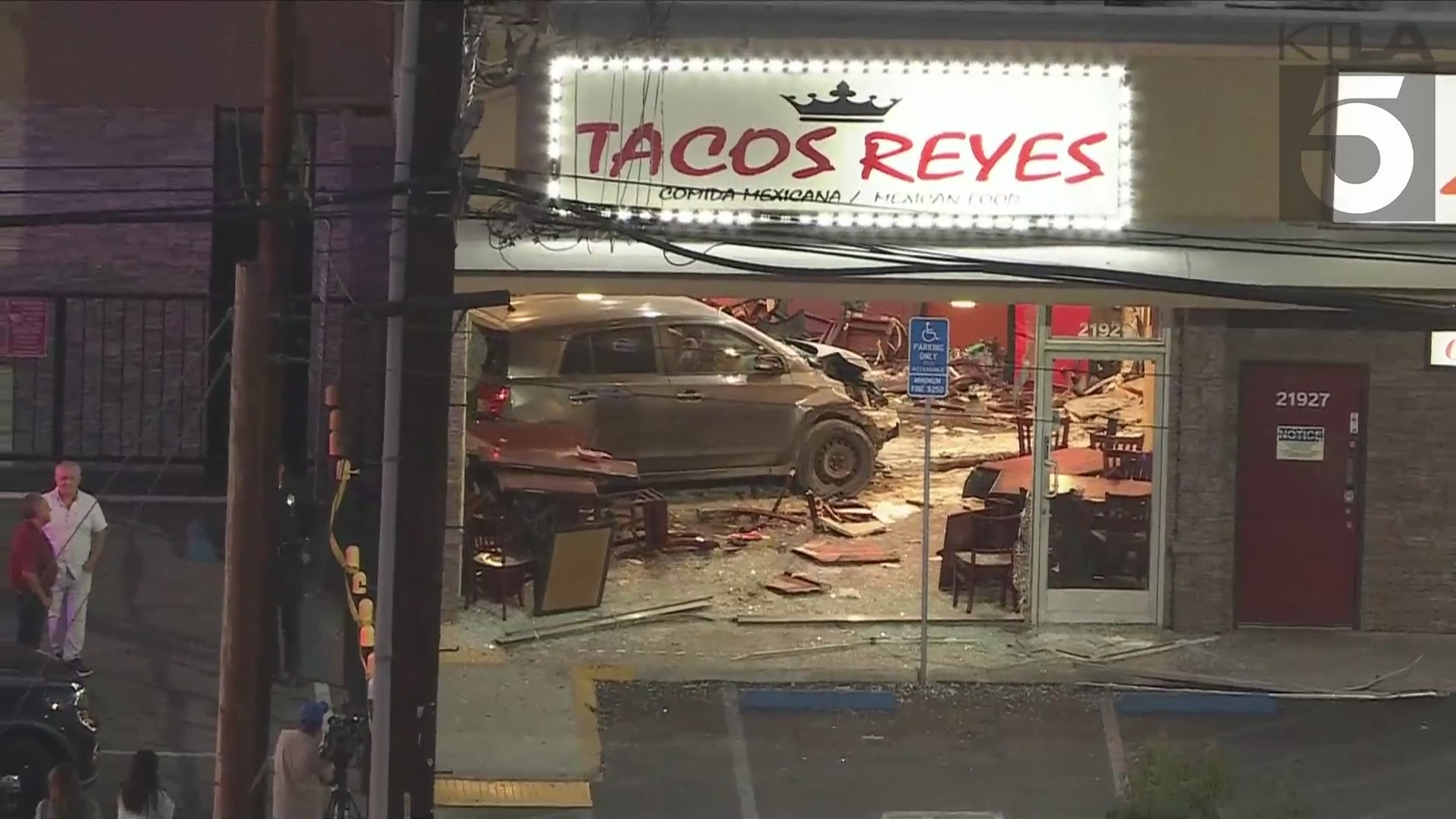 A woman was arrested after intentionally crashing her car into a taco shop in Canoga Park on August 9, 2024. (KTLA)