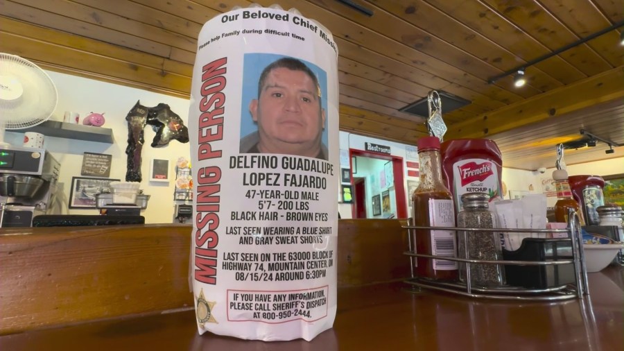 Missing posters of Delfino Guadalupe Lopez Fajardo can be seen at the Red Kettle restaurant in Idyllwild where he worked for over 20 years. (KTLA)