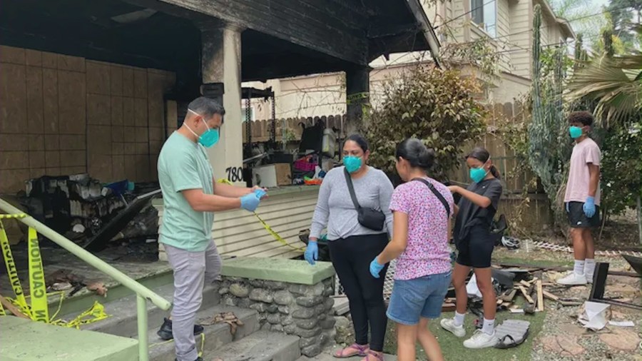 The Majano family, with the help of friends, family and neighbors, are salvaging whatever they can from their torched home. (GoFundMe)