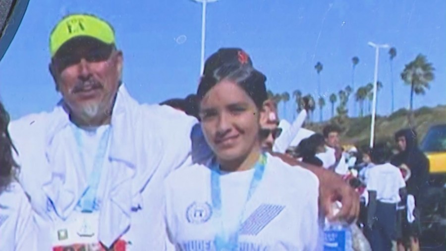 Mayanin Vazquez, 16, is seen with her father after running a marathon together. (Vazquez Family)