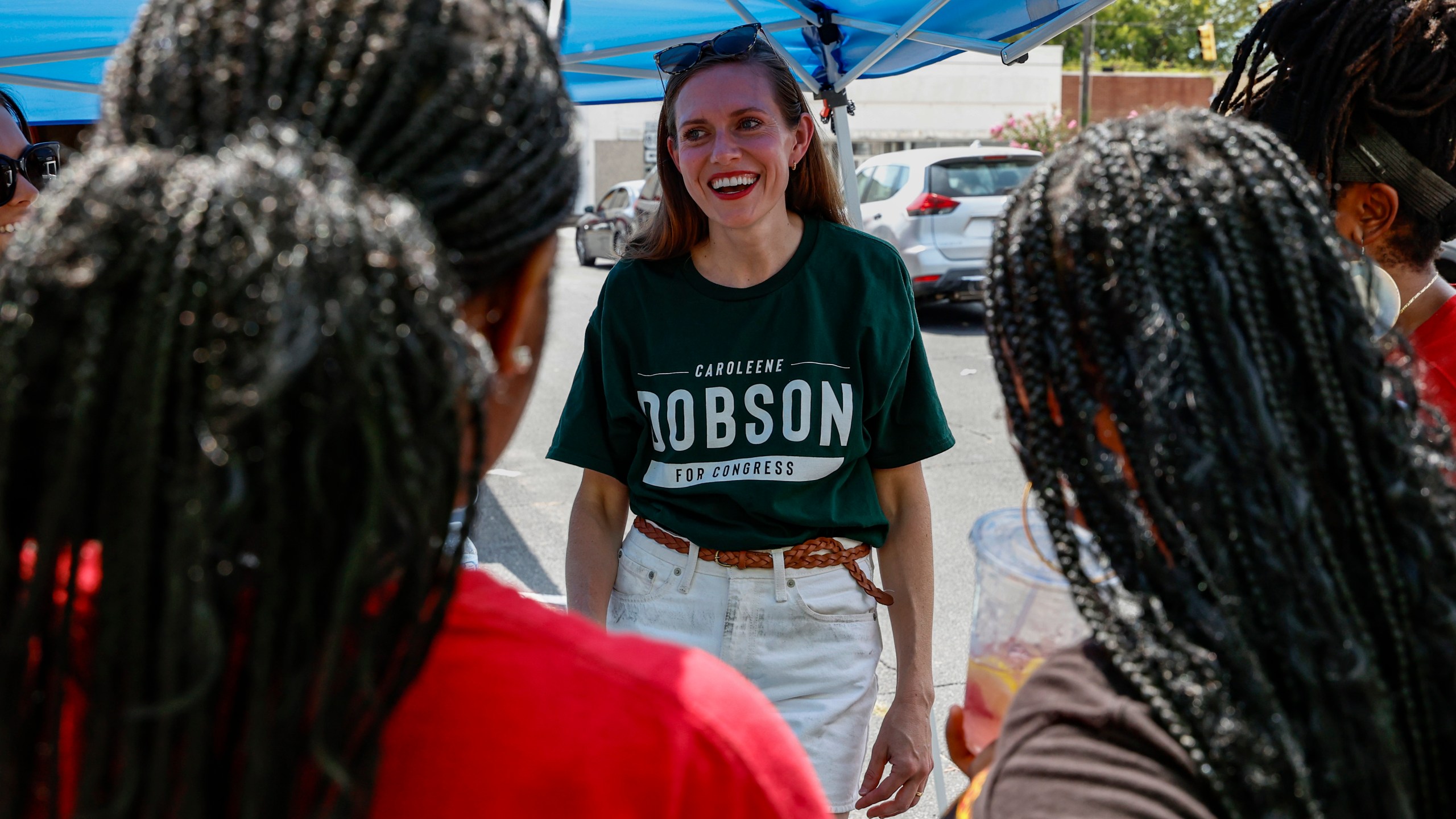 Alabama's new 2nd Congressional District Republican candidate Caroleene Dobson talks with voters during the Macon County Day Festival in Tuskegee, Ala., on Saturday, Aug 31, 2024. (AP Photo/ Butch Dill)