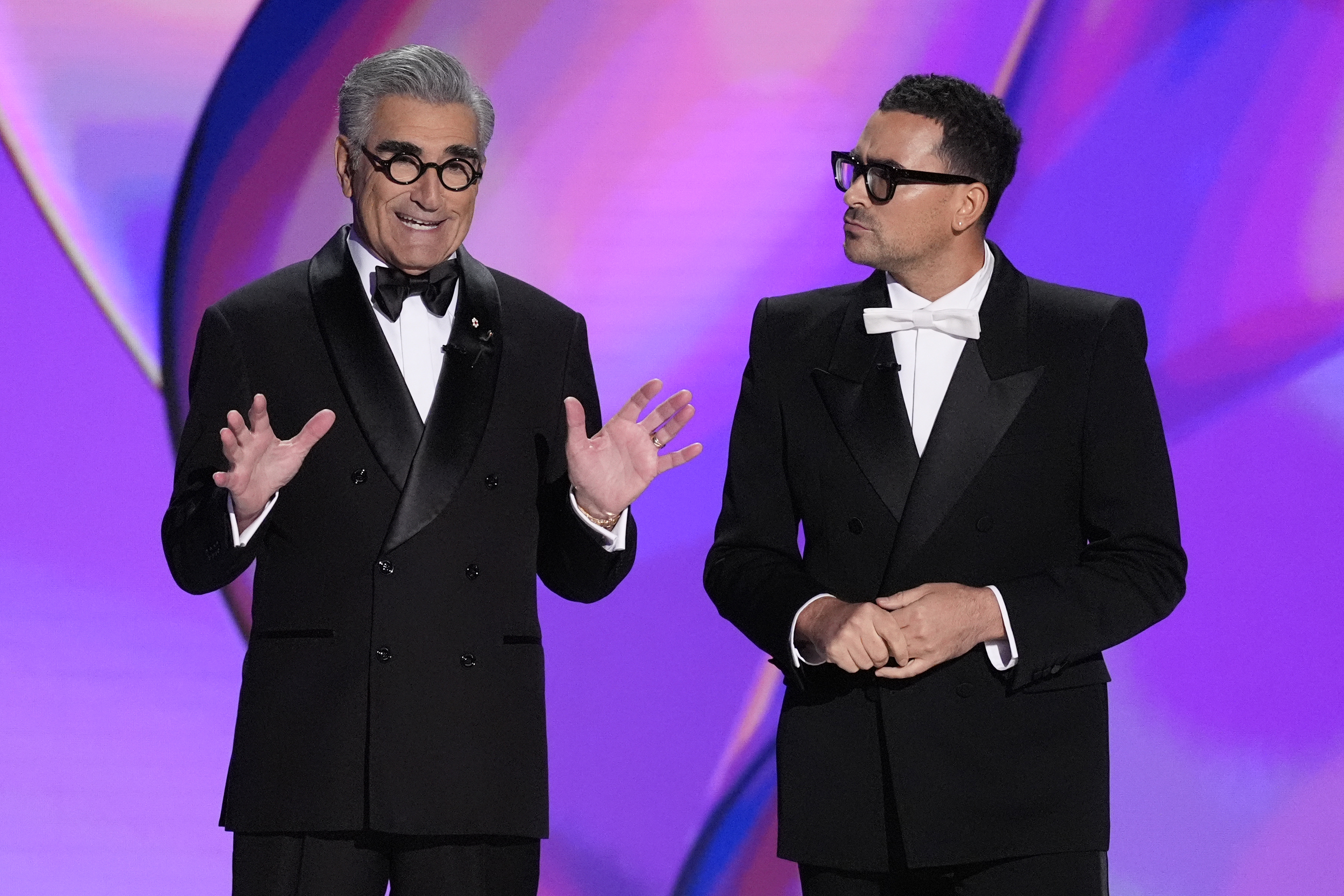 Hosts Eugene Levy and Dan Levy speak during the 76th Primetime Emmy Awards on Sunday, Sept. 15, 2024, at the Peacock Theater in Los Angeles. (AP Photo/Chris Pizzello)