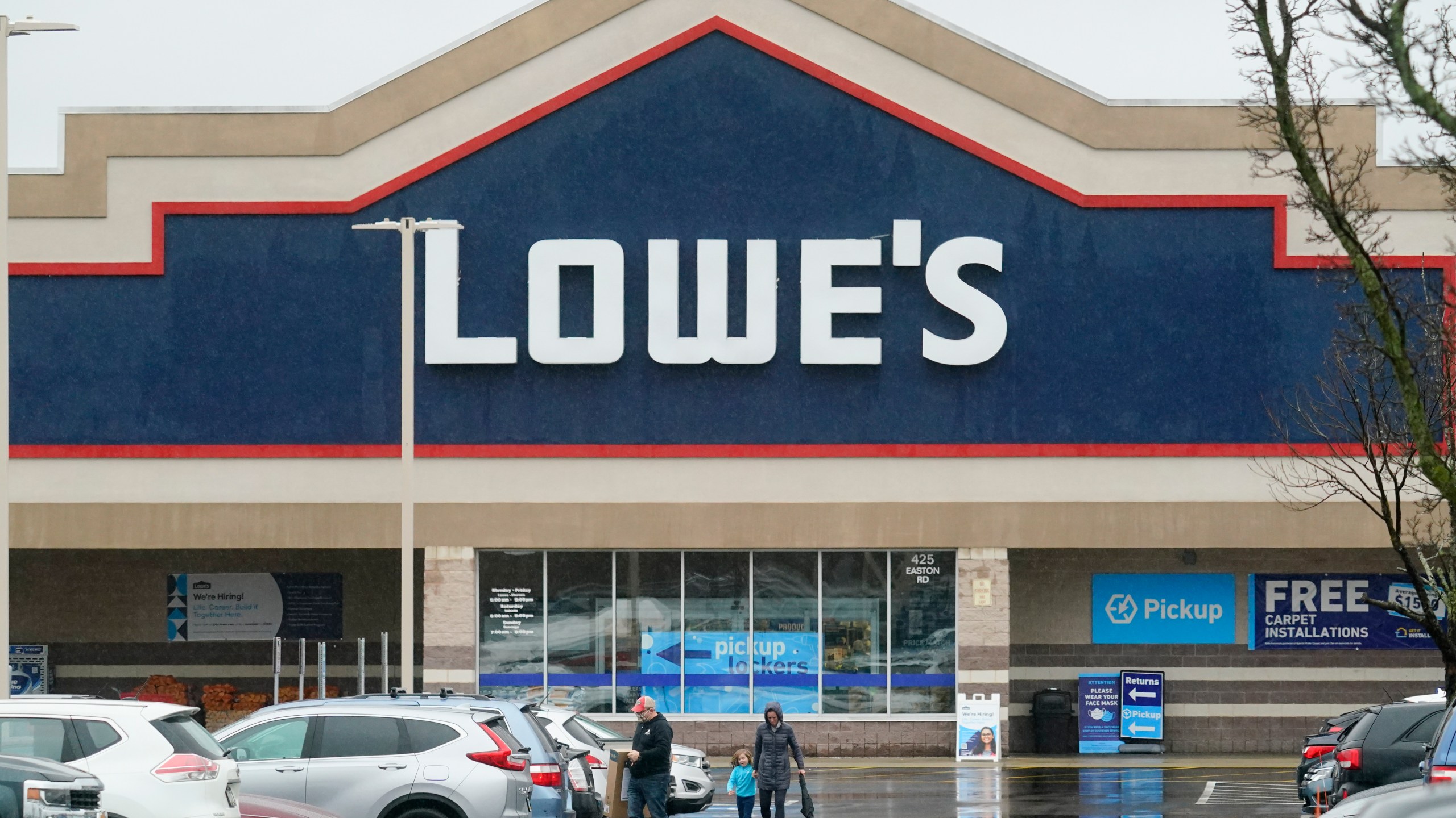 Shoppers exit a Lowe's home improvement store on Feb. 4, 2022. (AP Photo/Matt Rourke, File)