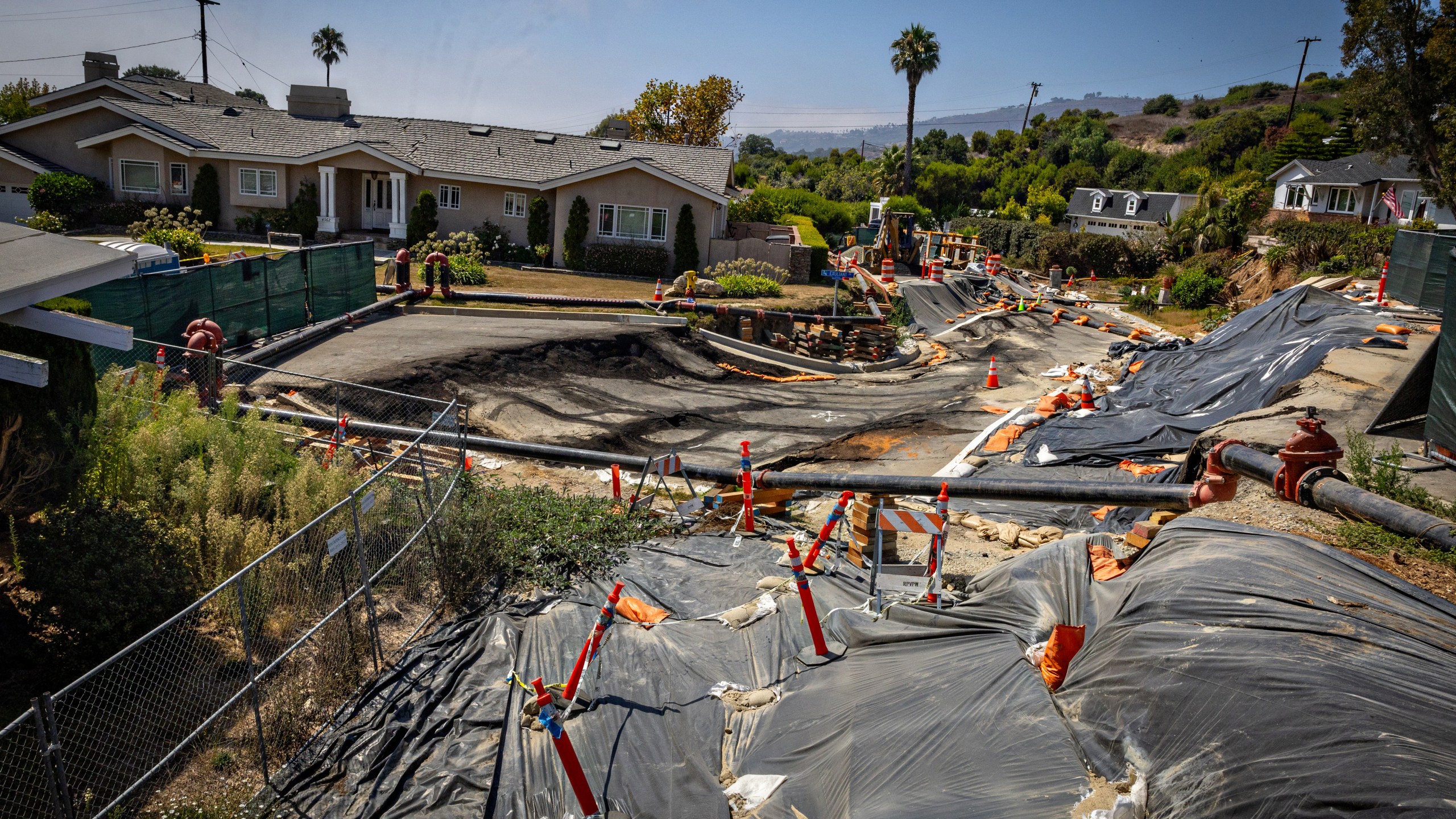 Severe landslide damage on Dauntless Drive near the Portuguese Bend Community on the Rancho Palos Verdes were an evacuation warning has been issued due to electricity being cut on Sunday, Sept. 1, 2024 in Rancho Palos Verdes, CA. (Jason Armond / Los Angeles Times via Getty Images)