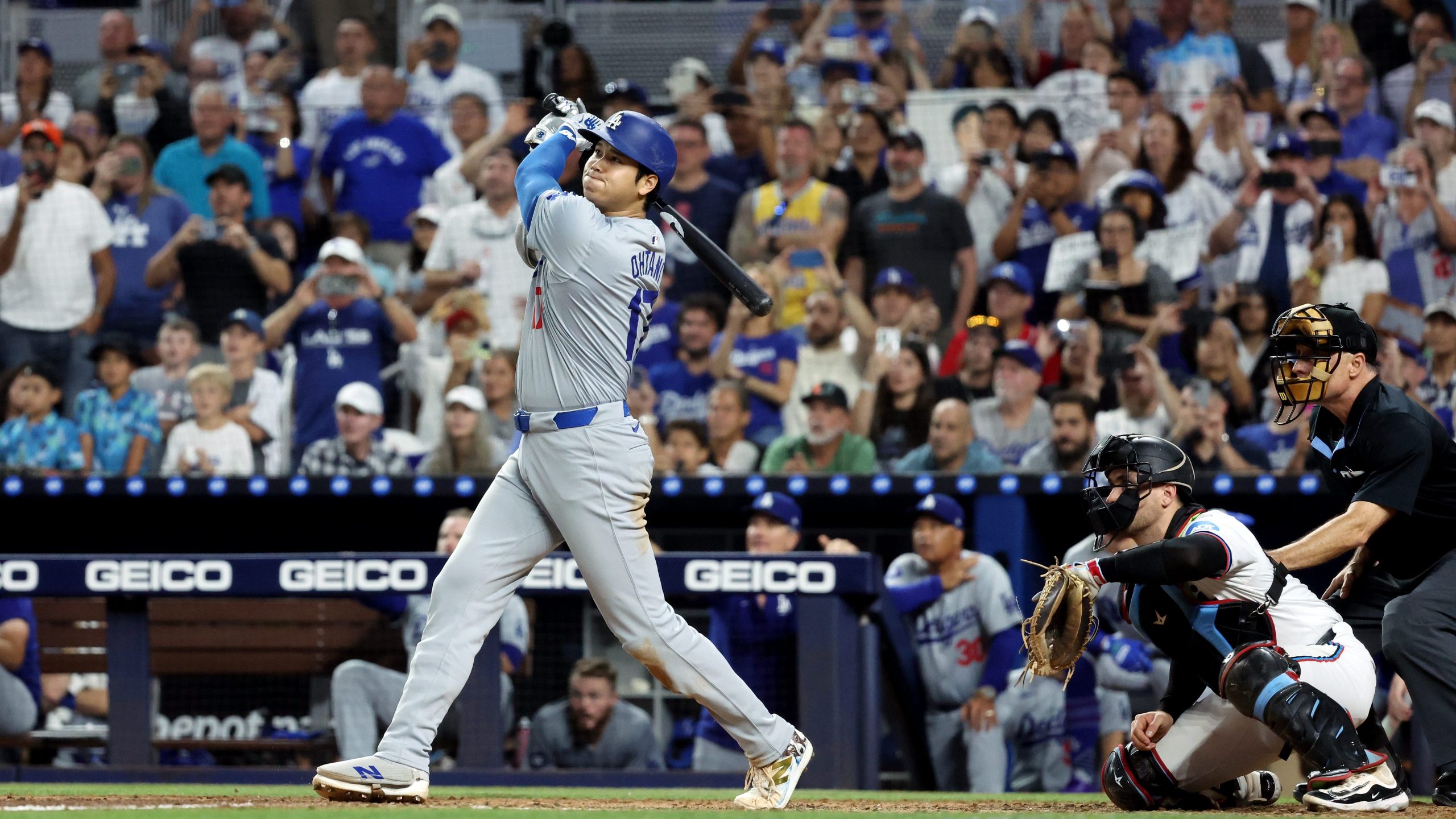 Shohei Ohtani of the Los Angeles Dodgers hits a three-run home run in the seventh inning to become the first player in Major League Baseball history to reach 50 Home Runs and 50 Stolen bases in a single season during the game between the Los Angeles Dodgers and the Miami Marlins at loanDepot park on Thursday, September 19, 2024 in Miami, Florida. (Getty Images)