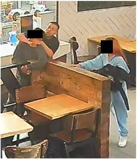 A suspect in an investigation involving the kidnapping and ransoming of migrants is seen in security footage attacking a victim who escaped to a Koreatown business on March 22, 2023. (United States Department of Justice)