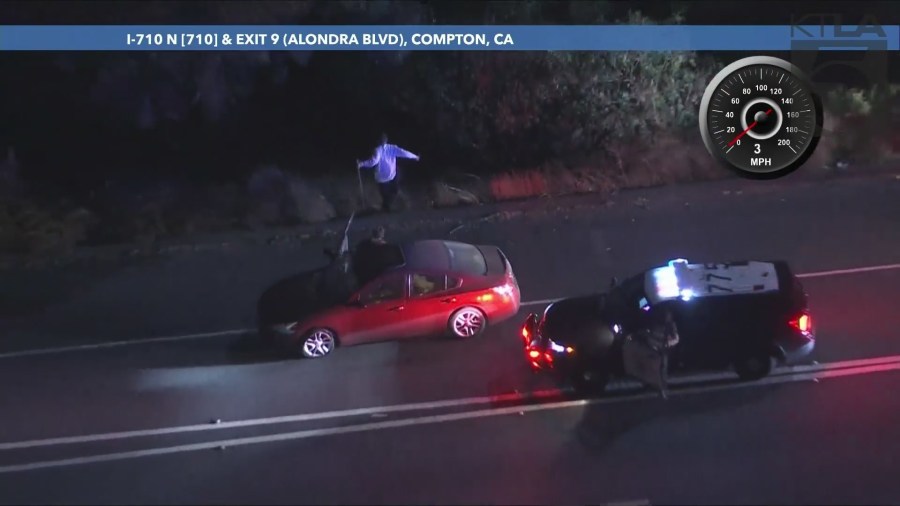 The two male suspects ditched the stolen car on the 710 Freeway in Compton and fled on foot before officers eventually found them. (KTLA)