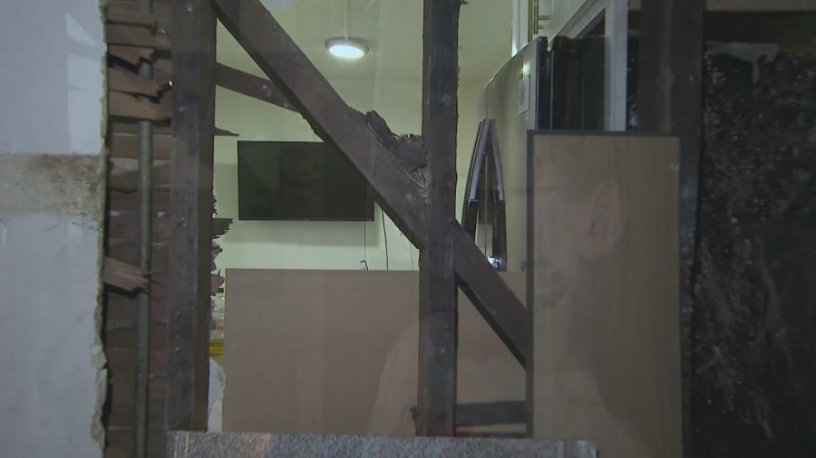 The fire destroyed a shared wall that left a clear view into a neighbor's apartment. (KTLA)