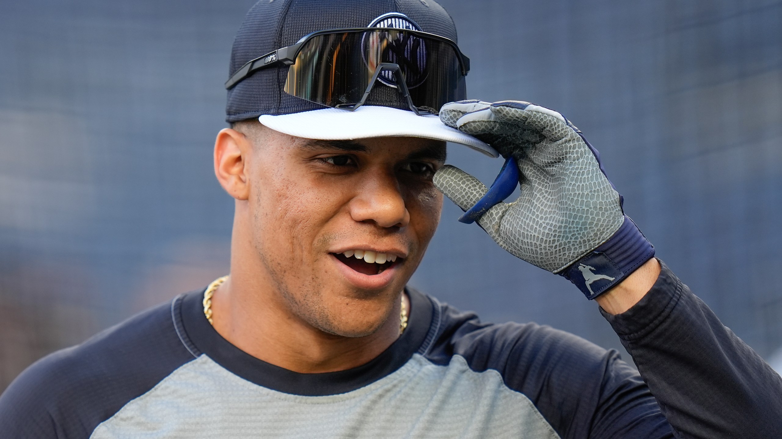 New York Yankees outfielder Juan Soto (22) warms up before playing against the Kansas City Royals in Game 2 of the American League baseball playoff series, Monday, Oct. 7, 2024, in New York. (AP Photo/Seth Wenig)