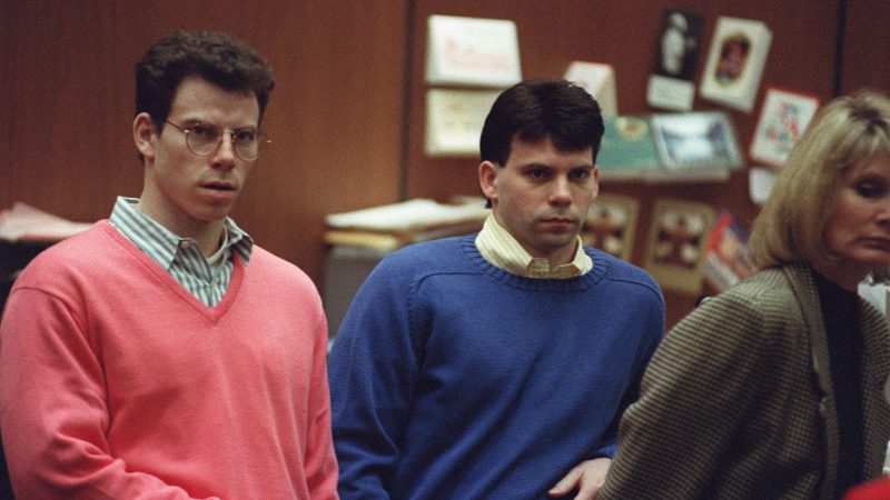 Erik Menendez (L) and his brother Lyle (R) listen during a pre-trial hearing, on December 29, 1992 in Los Angeles after the two pleaded innocent in the August 1989 shotgun deaths of their wealthy parents, Jose and Mary Louise Menendez of Beverly Hills, Calif. It took 40 months for the Superior Court arraignment after prosecutors and defense attorneys battled over the admissibility of taped confessions the brothers allegedly made to their psychotherapist. (Photo by VINCE BUCCI/AFP via Getty Images)