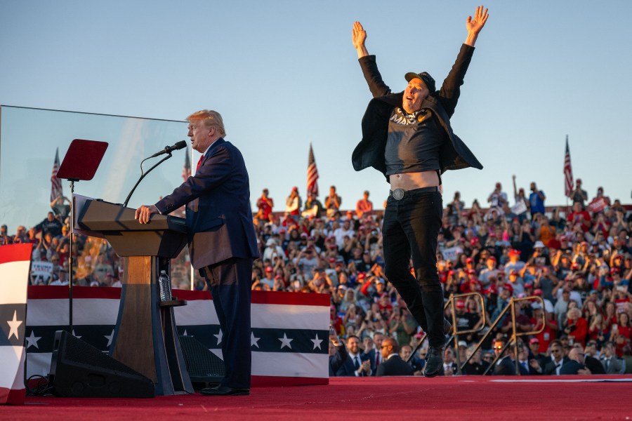 Tesla CEO Elon Musk jumps on stage as he joins former President and Republican presidential candidate Donald Trump during a campaign rally in Butler, Pennsylvania on Oct. 5, 2024. (Getty Images)