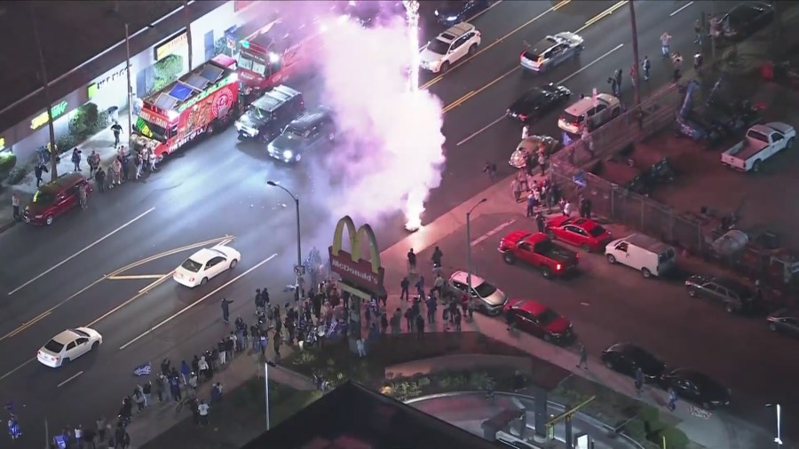 Fireworks and sparklers go off as fans take to the streets to celebrate after the Dodgers captured their 8th World Series title, coming from behind to beat the New York Yankees 7-6 in Game 5 on Oct. 5, 2024. (KTLA)