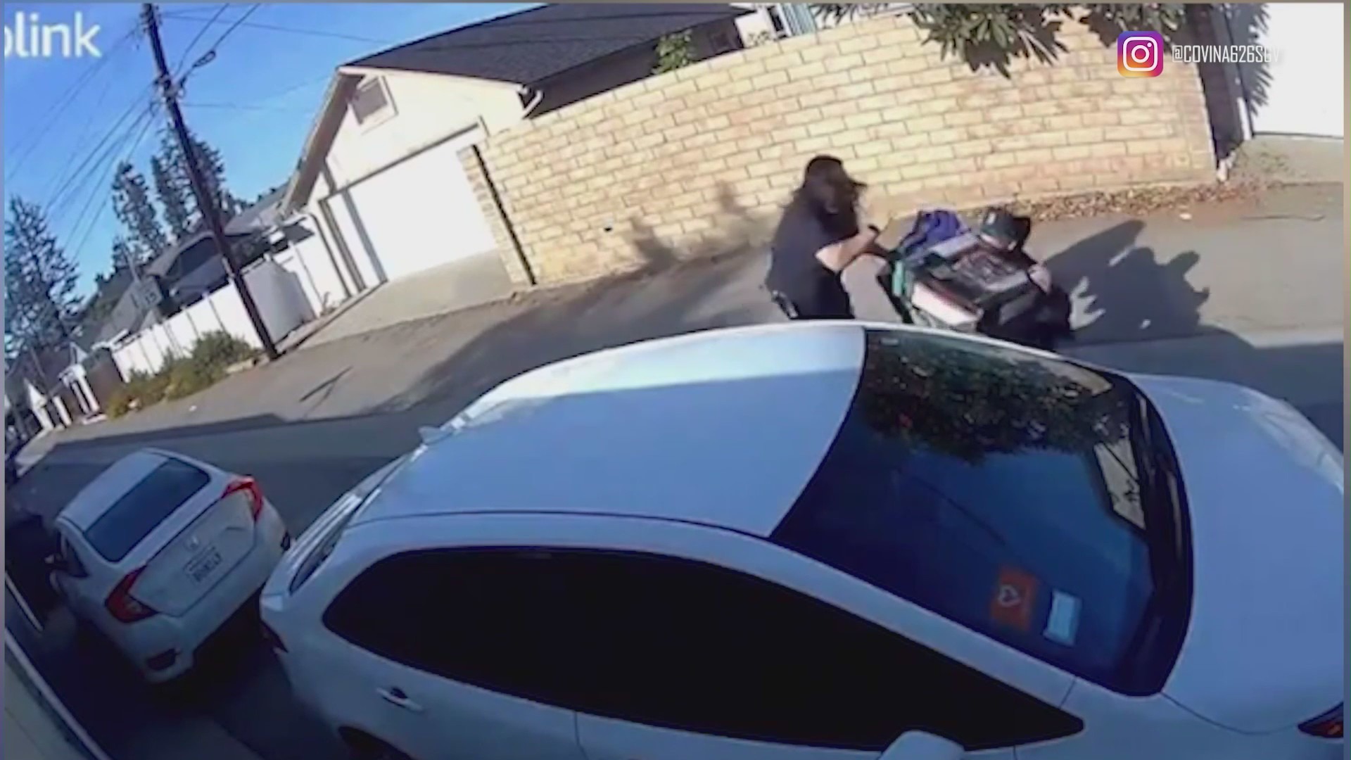 The Target employee grabs the suspect's face and shoves him to the ground after he allegedly stole merchandise from a Target store in Azusa. (@covina626sgv)