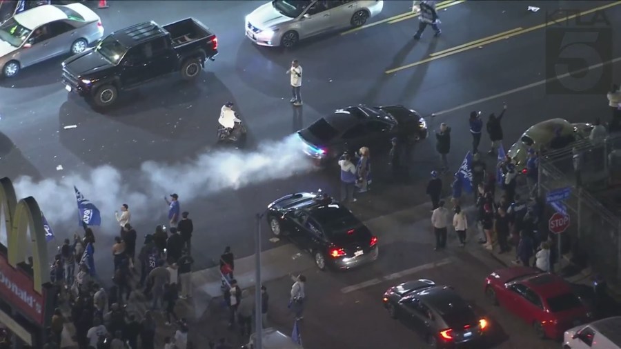 Fans in East L.A. take to the streets to celebrate after the Dodgers captured their 8th World Series title, coming from behind to beat the New York Yankees 7-6 in Game 5 on Oct. 5, 2024. (KTLA)