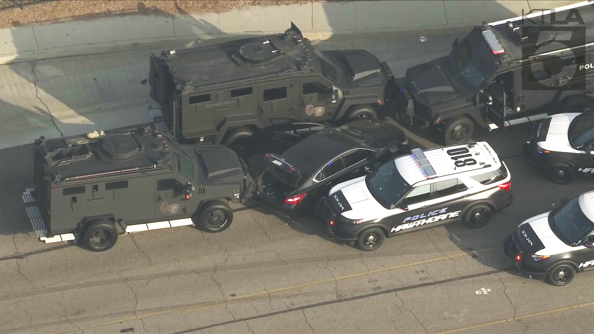 The suspect was boxed in by SWAT team vehicles and taken into custody after an hours-long standoff in El Segundo on Oct. 15, 2024. (KTLA)
