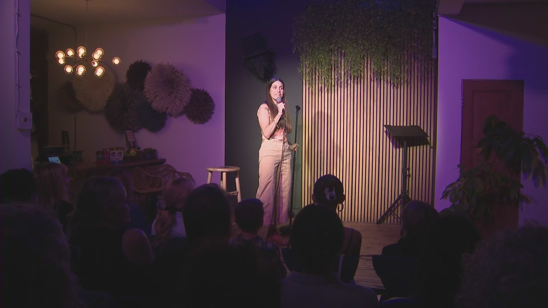 Nicole Blaine, the creator of Storyectomy, takes the stage at The Crow Comedy Club in Santa Monica. (KTLA)