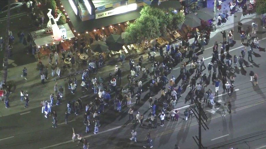 Fans in Silver Lake take to the streets to celebrate after the Dodgers captured their 8th World Series title, coming from behind to beat the New York Yankees 7-6 in Game 5 on Oct. 5, 2024. (KTLA)