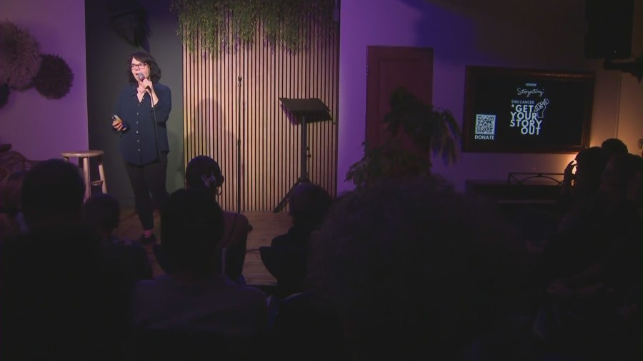 Audiences watch as Storyectomy participants share their stories at The Crow Comedy Club in Santa Monica. (KTLA)