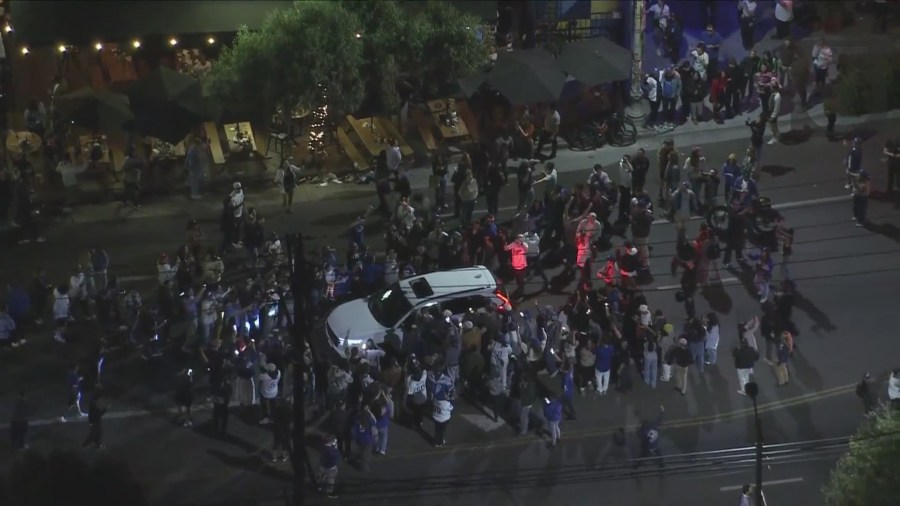 Fans in Silver Lake take to the streets to celebrate after the Dodgers captured their 8th World Series title, coming from behind to beat the New York Yankees 7-6 in Game 5 on Oct. 5, 2024. (KTLA)