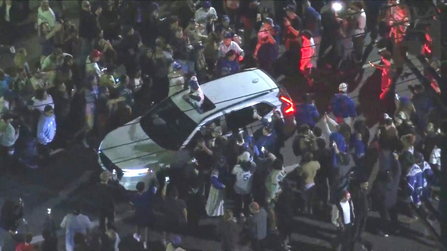Fans in Silver Lake take to the streets to celebrate after the Dodgers captured their 8th World Series title, coming from behind to beat the New York Yankees 7-6 in Game 5 on Oct. 5, 2024. (KTLA)