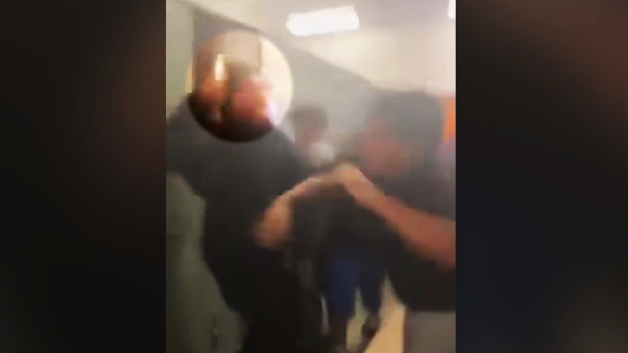 The suspect student is seen brandishing a knife during a fight in a locker room at Frisbie Middle School in Rialto on Oct. 11, 2024. 