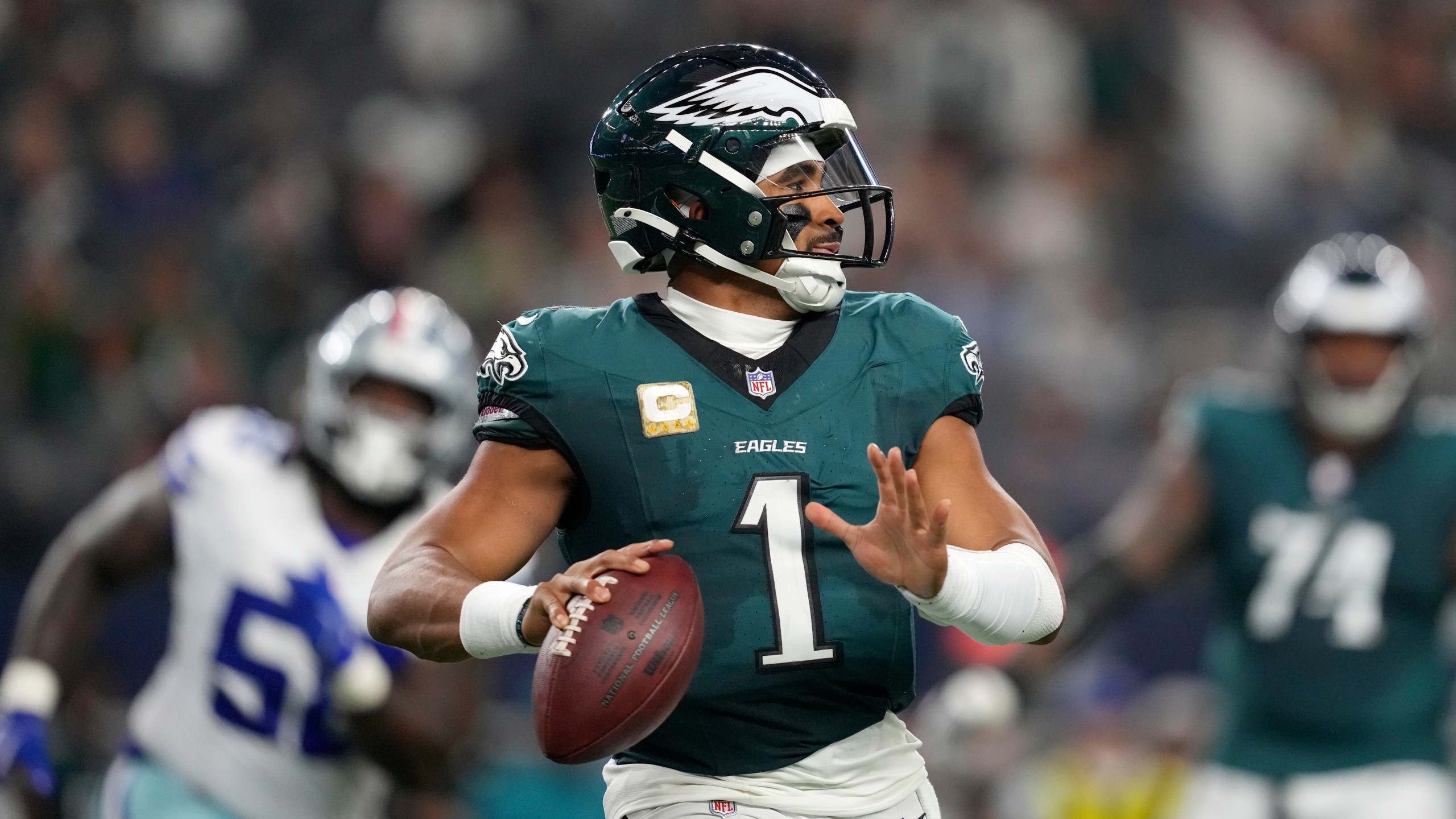 Philadelphia Eagles' Jalen Hurts prepares to throw a pass in the second half of an NFL football game against the Dallas Cowboys in Arlington, Texas, Sunday, Nov. 10, 2024. (AP Photo/Jeffrey McWhorter)