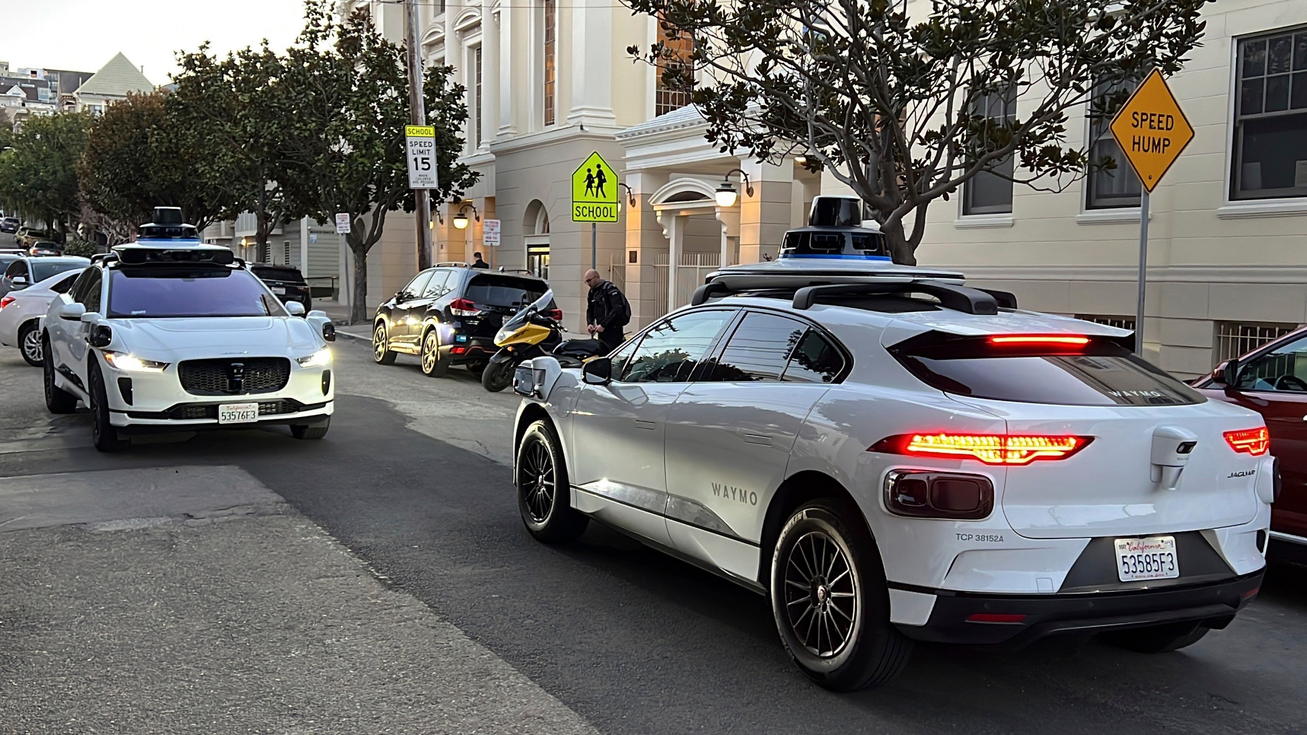 FILE - Two Waymo driverless taxis stop before passing one another on a San Francisco street on Feb. 15, 2023. (AP Photo/Terry Chea, File)