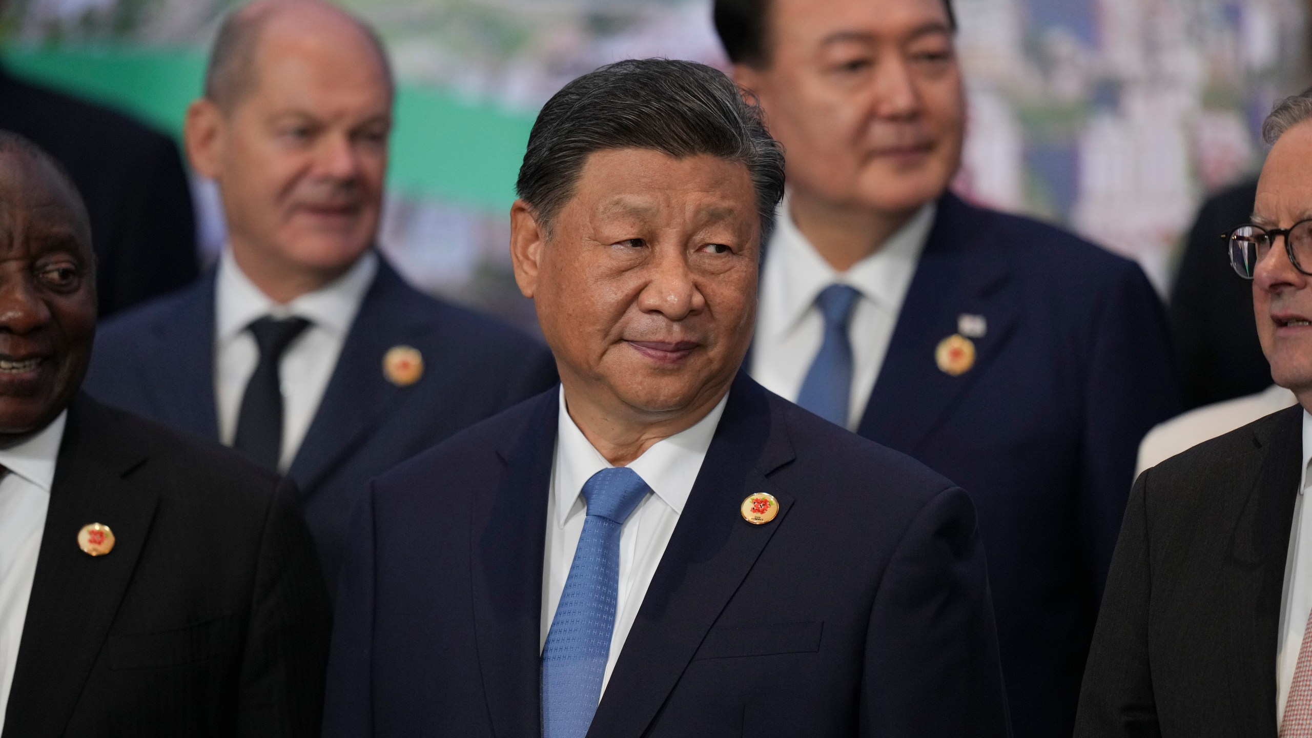 China's President Xi Jinping gathers for the world leaders' group photo at the G20 Summit, in Rio de Janeiro, Tuesday, Nov. 19, 2024. (AP Photo/Silvia Izquierdo)