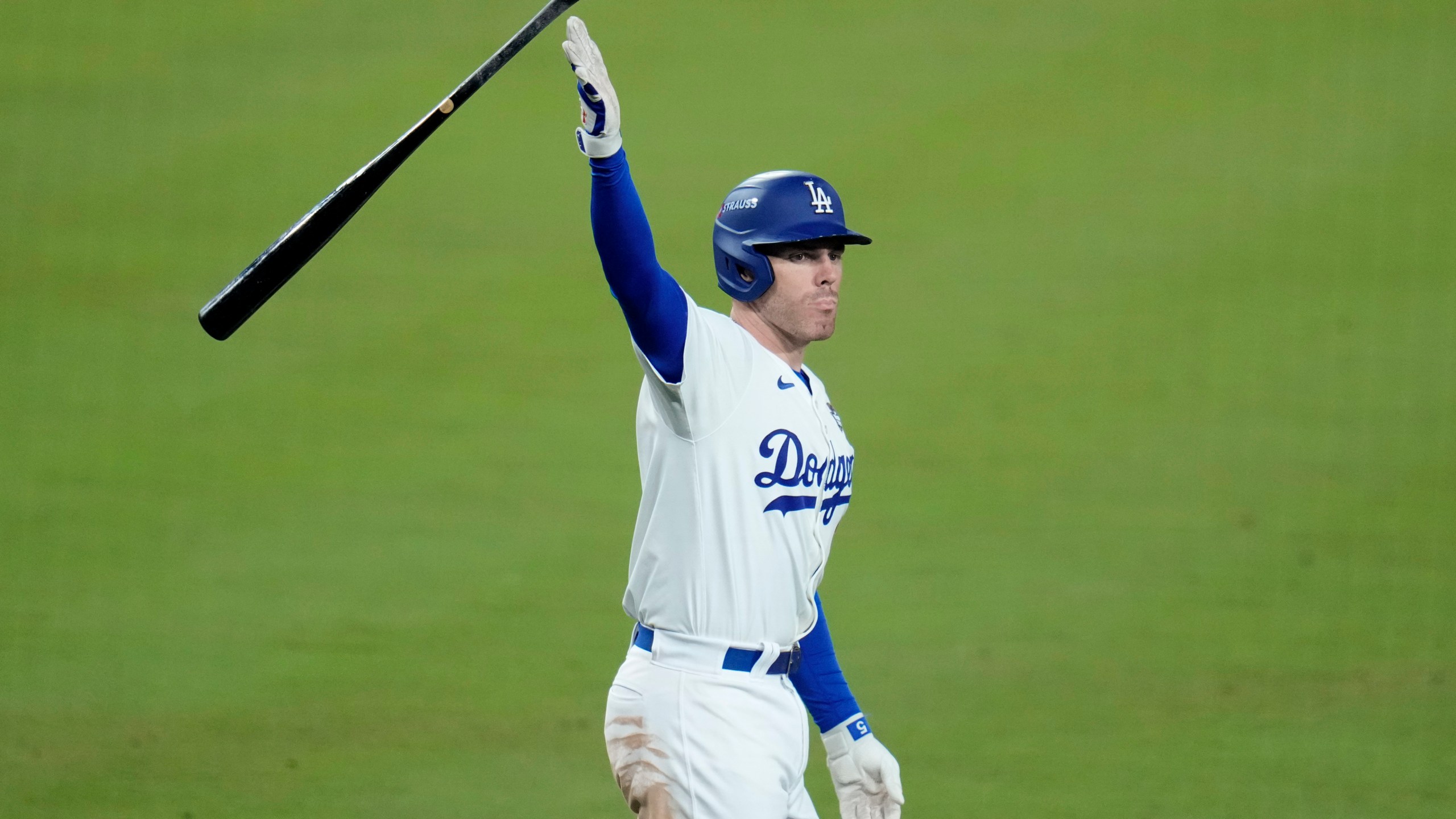 Los Angeles Dodgers' Freddie Freeman celebrates after hitting a game-winning grand slam against the New York Yankees during the 10th inning in Game 1 of the baseball World Series, Friday, Oct. 25, 2024, in Los Angeles. The Dodgers won 6-3. (AP Photo/Julio Cortez)