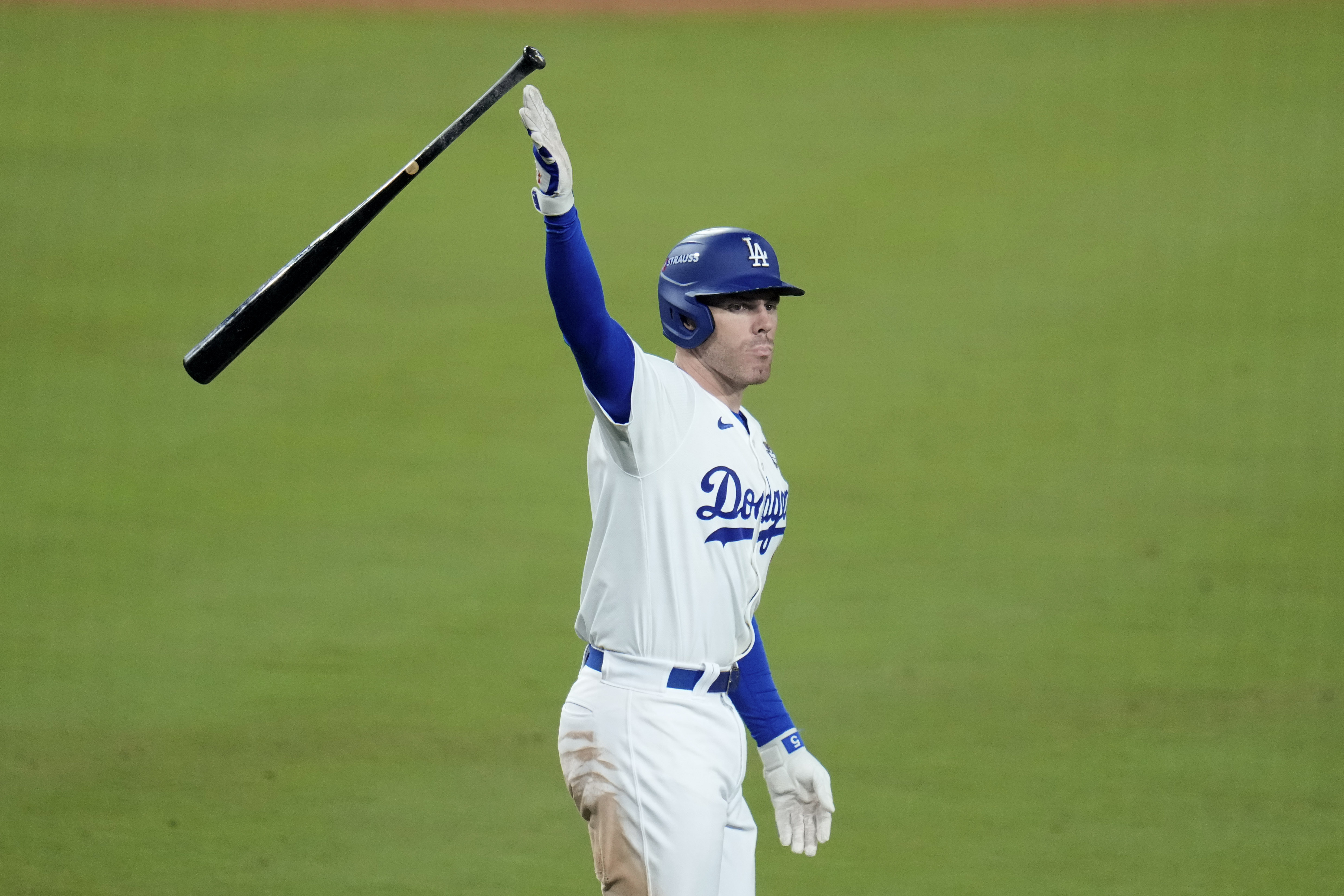 Los Angeles Dodgers' Freddie Freeman celebrates after hitting a game-winning grand slam against the New York Yankees during the 10th inning in Game 1 of the baseball World Series, Friday, Oct. 25, 2024, in Los Angeles. The Dodgers won 6-3. (AP Photo/Julio Cortez)