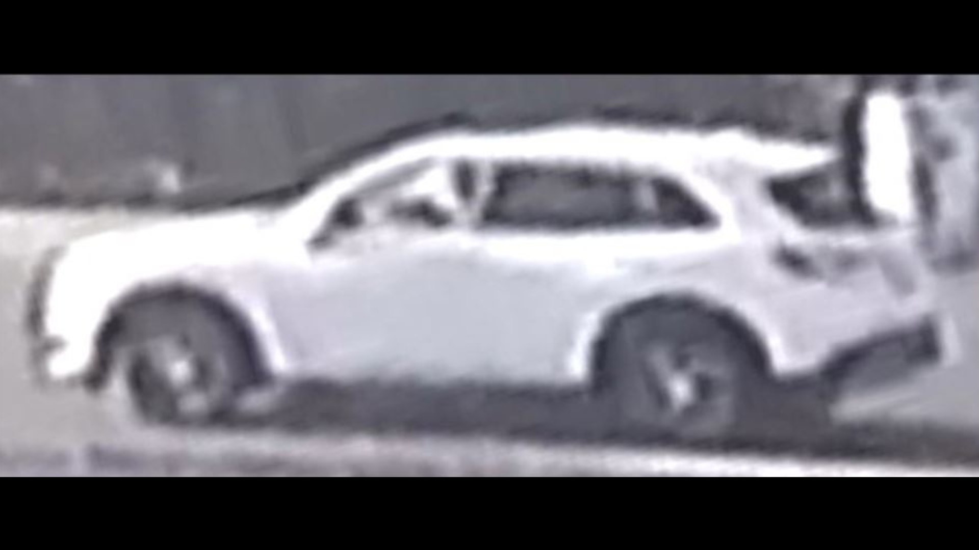 The suspect's white SUV with possible front-end damage was seen by a nearby surveillance camera after a deadly hit-and-run crash in Carson on Aug. 31, 2024. (Carson Sheriff's Station)