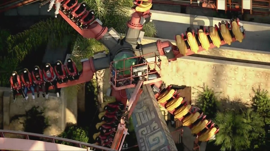 Stuck riders are seen suspended in air aboard the Sol Spin ride at Knott's Berry Farm on Nov. 18, 2024. (KTLA)