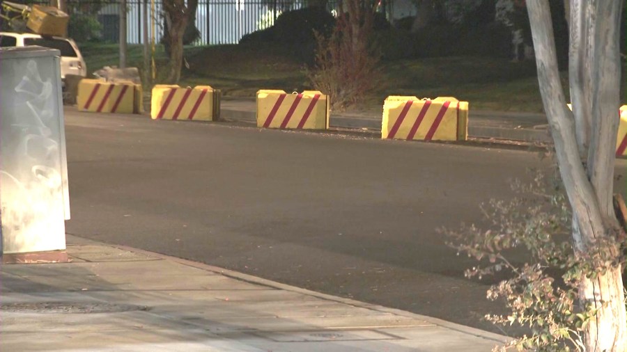 Heavy, brightly-colored concrete barriers have been inexplicably placed on streets across the West San Fernando Valley area in a possible attempt to prevent homeless encampments and long-term RV parking. (KTLA)
