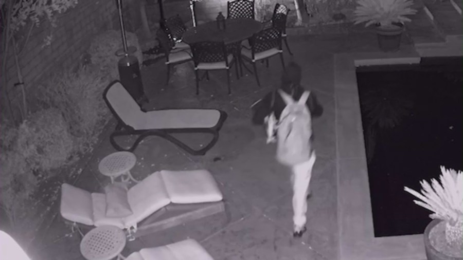 Home security cameras captured a male suspect trepassing through a backyard.