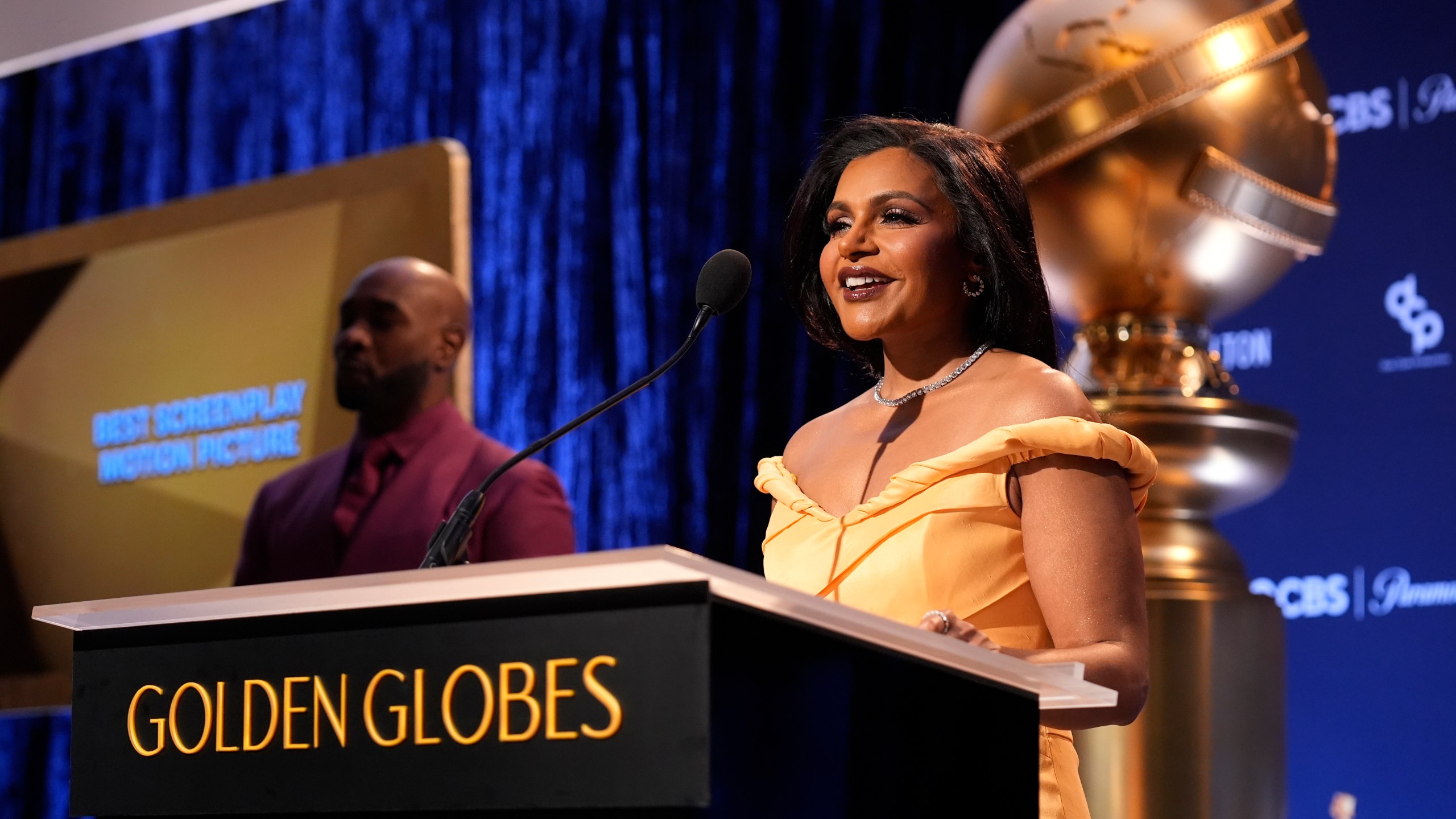 Mindy Kaling, right, speaks as Morris Chestnut looks on during the nominations for the 82nd Golden Globes on Monday, Dec. 9, 2024, at the Beverly Hilton Hotel in Beverly Hills, Calif. The 82nd Golden Globes will be held on Sunday, Jan. 5, 2025. (AP Photo/Chris Pizzello)