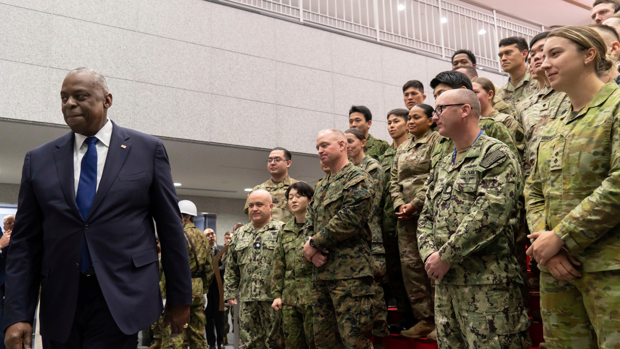 U.S. Secretary of Defense Lloyd Austin, left, leaves after addressing military personnel from Japan, the United States, and Australia during a visit to Camp Asaka, a Japan Ground Self-Defense Force base, on the outskirts of Tokyo Wednesday, Dec. 11, 2024. (Tomohiro Ohsumi/Pool Photo via AP)