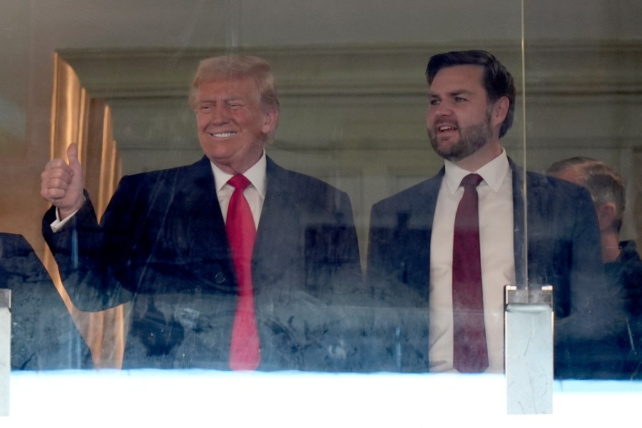President-elect Donald Trump, left, and Vice President-elect JD Vance attend the NCAA college football game between Army and Navy at Northwest Stadium in Landover, Md., Saturday, Dec. 14, 2024. (AP Photo/Stephanie Scarbrough)