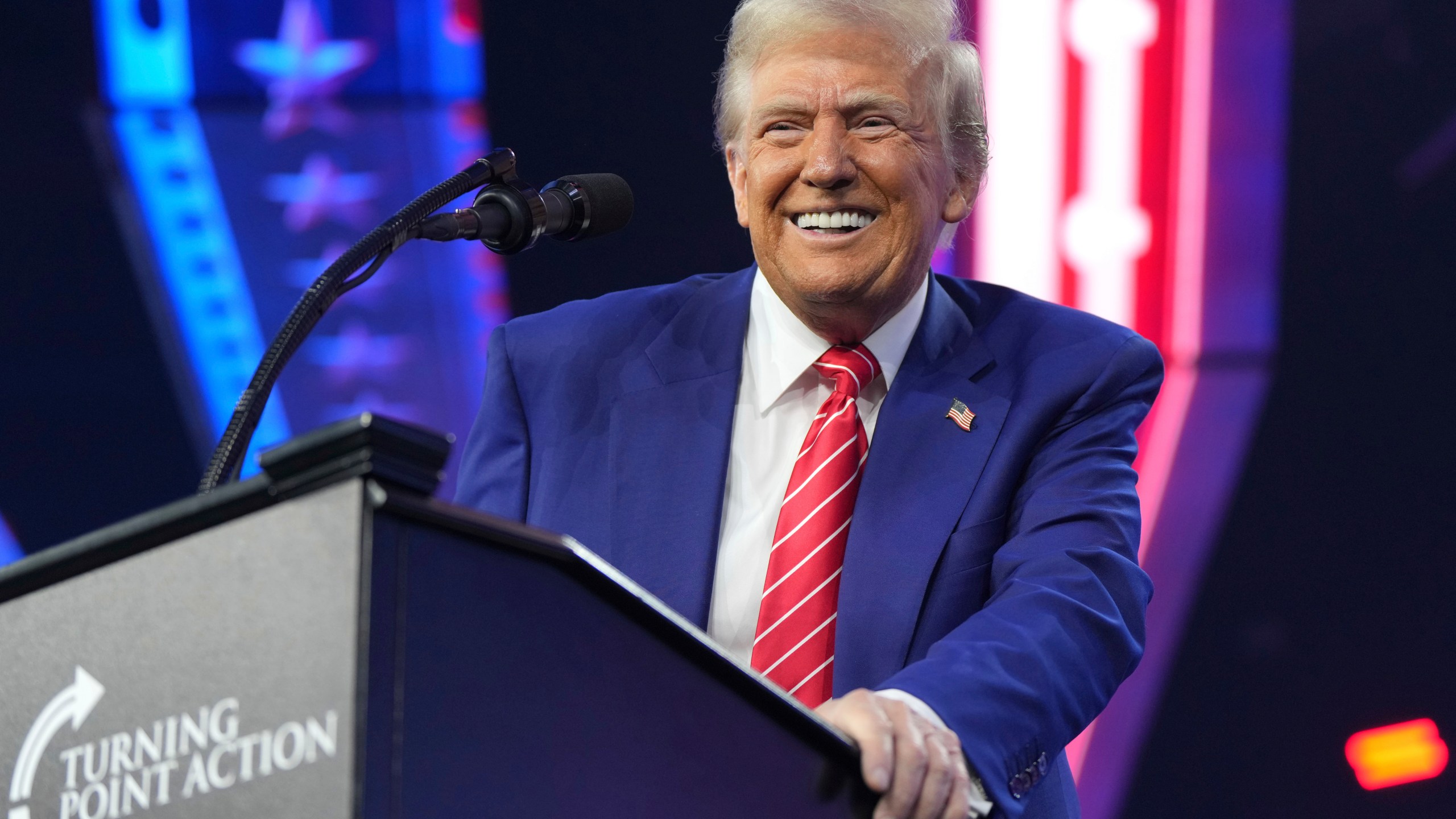 President-elect Donald Trump speaks at AmericaFest, Sunday, Dec. 22, 2024, in Phoenix. (AP Photo/Rick Scuteri)