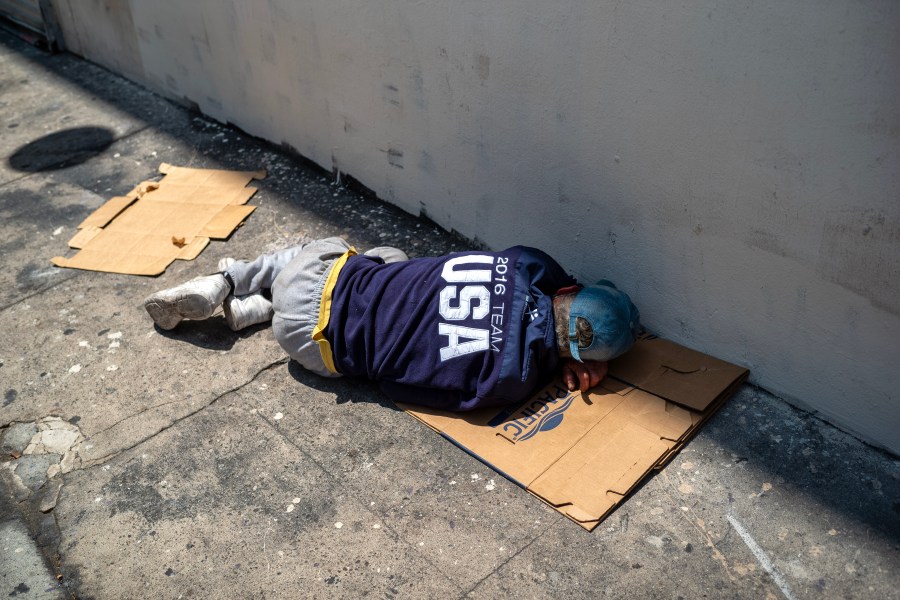 A man sleeps on the sidewalk in Los Angeles, Tuesday, June 27, 2023. (Getty Images)