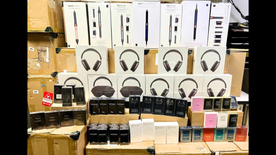 A collection of designer fragrances and high-end merchandise was found during a retail theft bust in Costa Mesa on Dec. 17, 2024. (Costa Mesa Police Department)