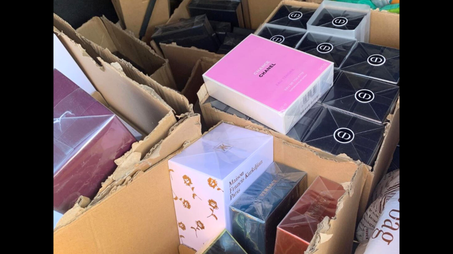 A collection of designer fragrances and high-end merchandise was found during a retail theft bust in Costa Mesa on Dec. 17, 2024. (Costa Mesa Police Department)