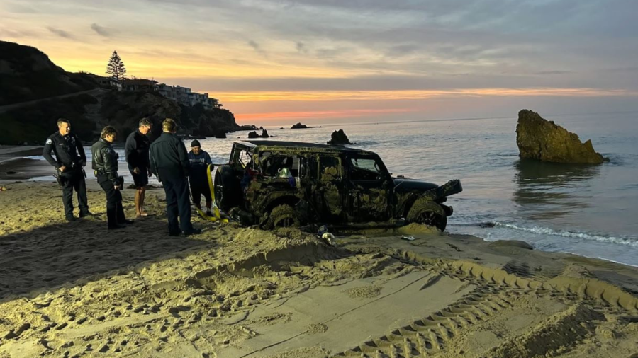 One person was rescued after emergency crews removed a Jeep Wrangler SUV found submerged in ocean waters at Corona del Mar State Beach on Dec. 14, 2024. (Newport Beach Fire Department)
