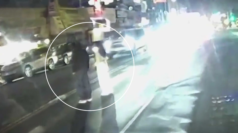 Moments before the two victims were struck by a vehicle while standing in a median lane amid traffic in Koreatown on Nov. 28, 2024. (Los Angeles Police Department)