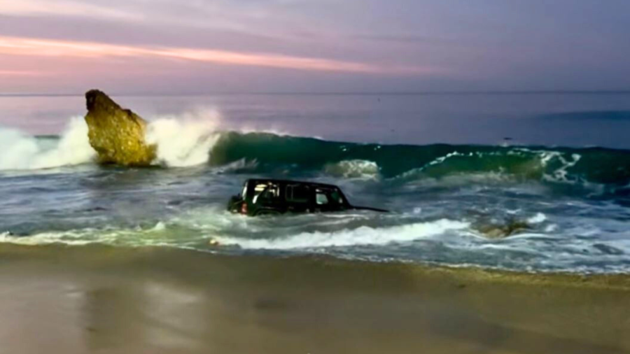 One person was rescued after emergency crews removed a Jeep Wrangler SUV found submerged in ocean waters at Corona del Mar State Beach on Dec. 14, 2024. (Newport Beach Fire Department)